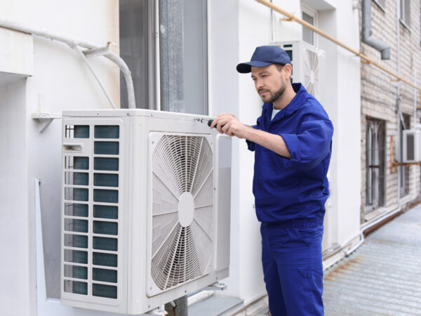 Male,Technician,Repairing,Air,Conditioner,Outdoors